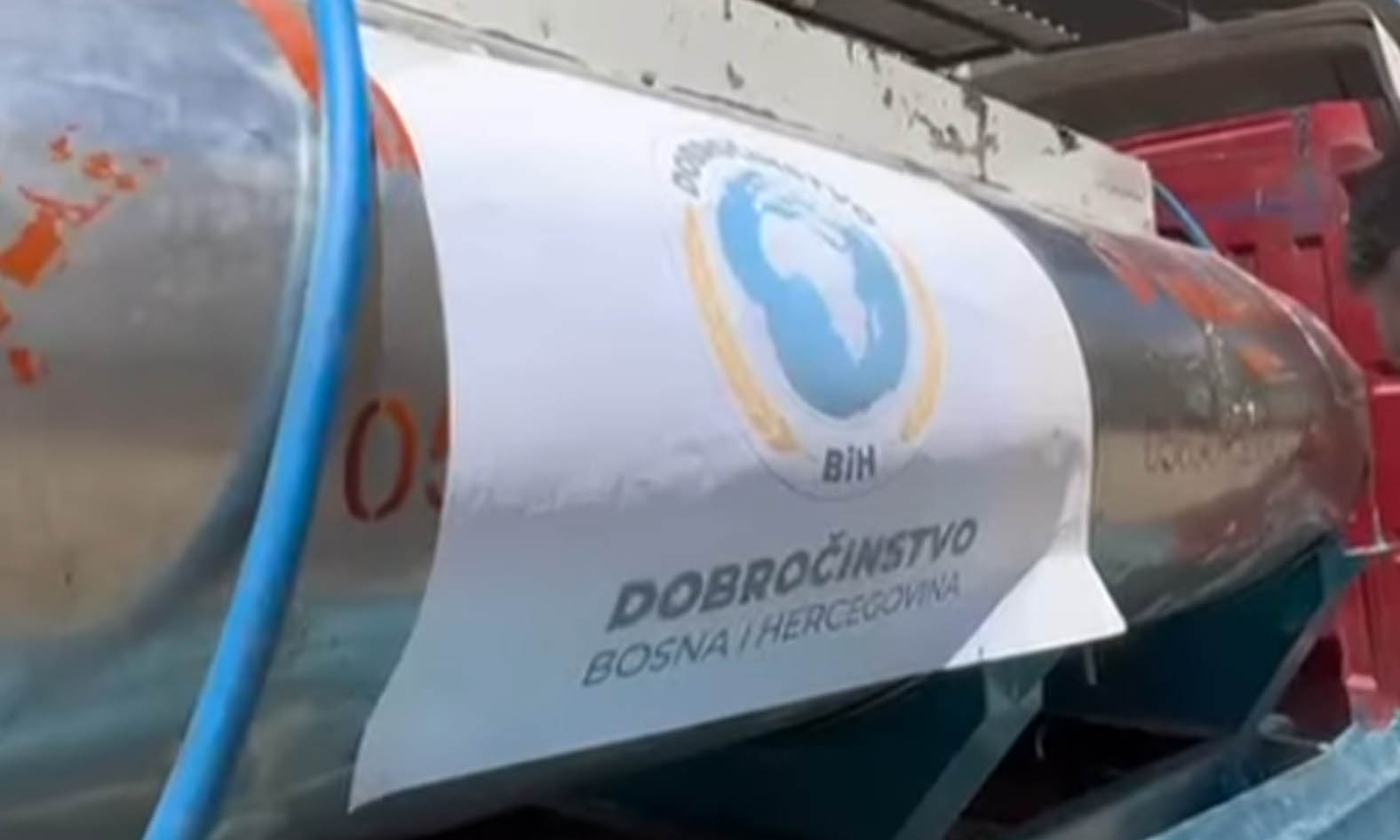 Sweet little girl with Down Syndrome, playing with paper heart.